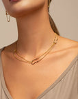 Nicole gold double chain necklace by PIERETTI worn on neck, lightweight layered necklace
