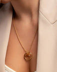 Chantal gold heart necklace by PIERETTI worn on neck, zirconia pendant chain necklace