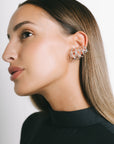 Model wearing Fefe Small, Medium and Large ear cuffs stacked together in Silver Plate by Pieretti