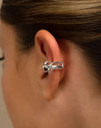 Clau silver ear cuff by PIERETTI worn on ear, twisted ear cuff no piercing