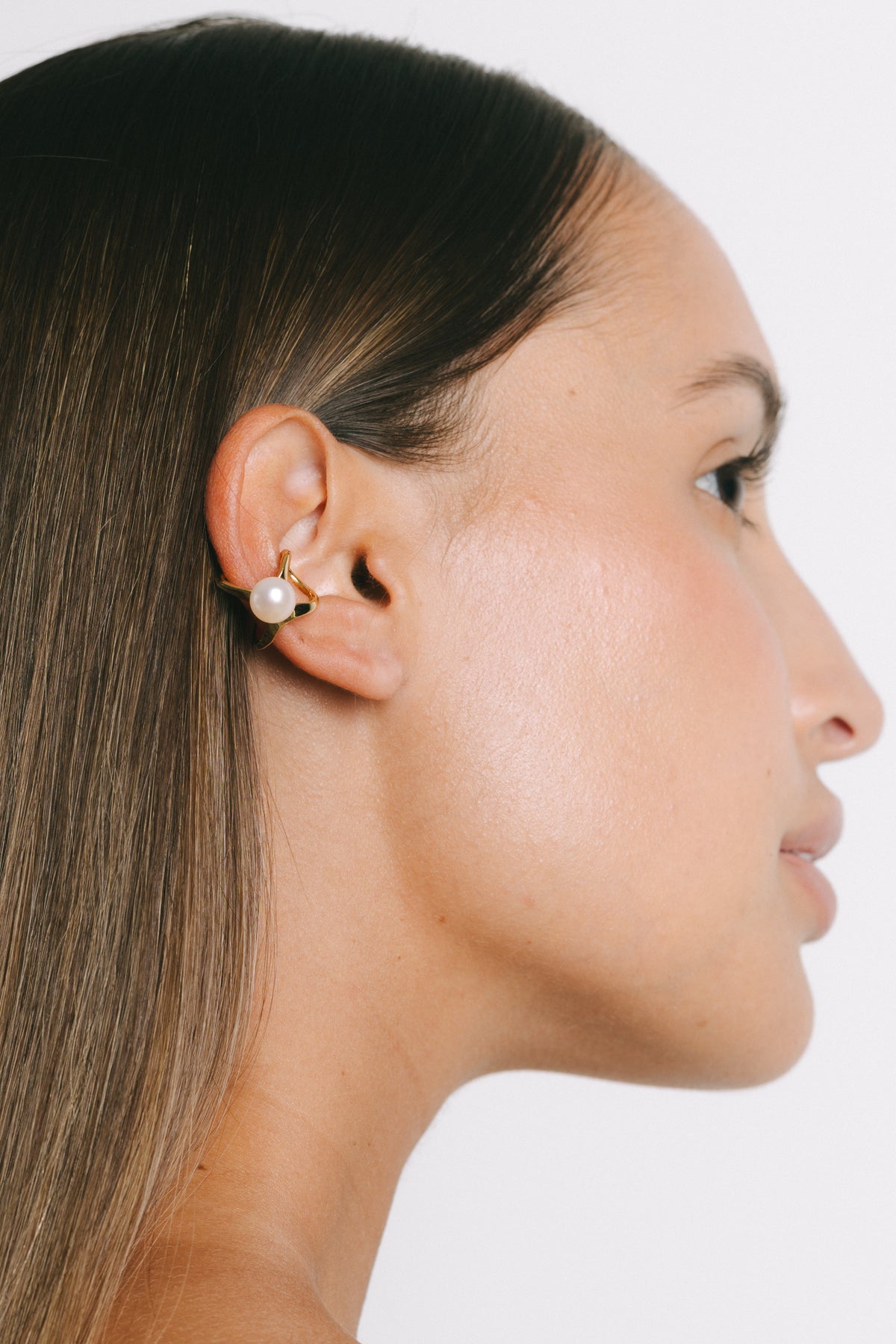 Model wearing Ferla Pearl Ear Cuff in Gold Plate by Pieretti