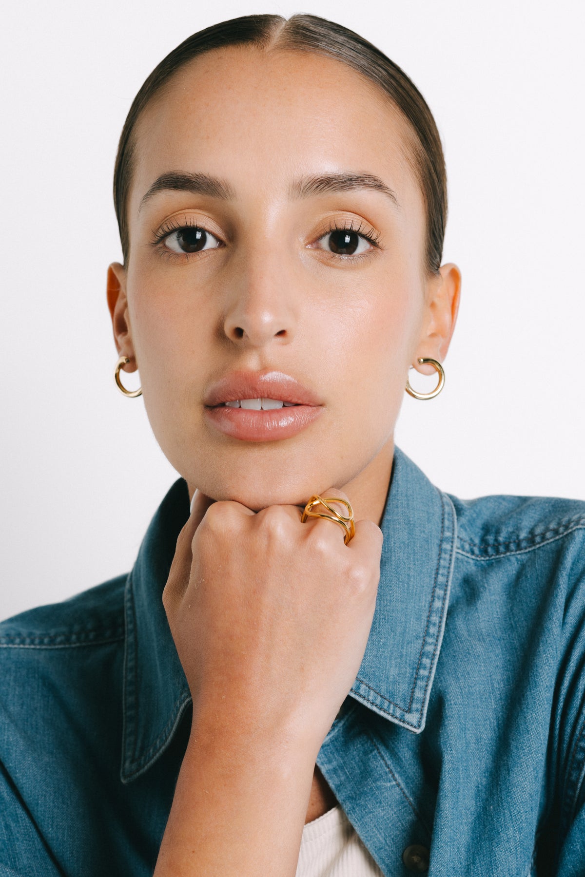 Model wearing Felice Zirconia Earrings in Gold Plate by Pieretti