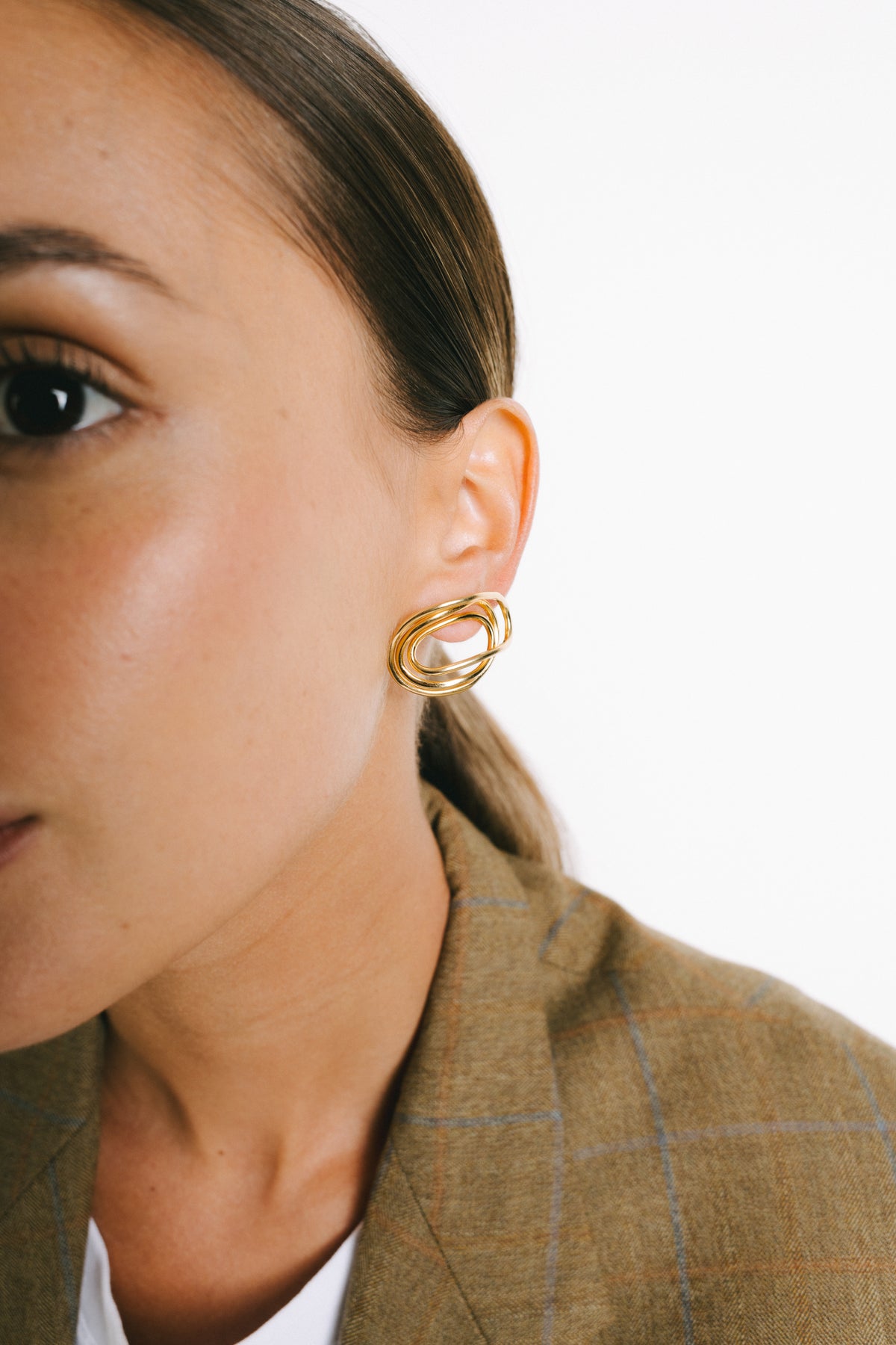 Model wearing Fonty Statement Earrings in Gold Plate by Pieretti