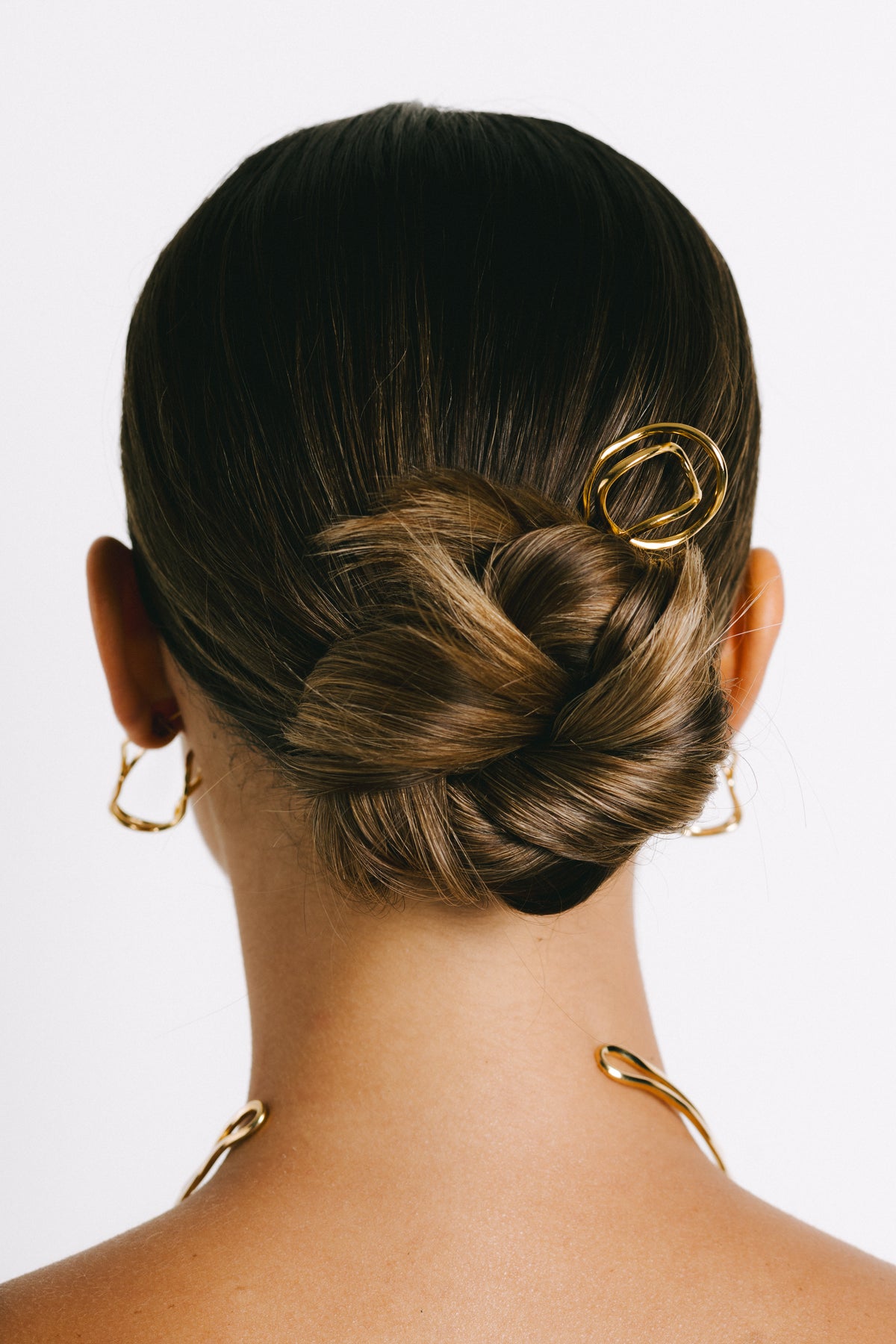 Model wearing Fumi French Hair Pin in Gold Plate by Pieretti