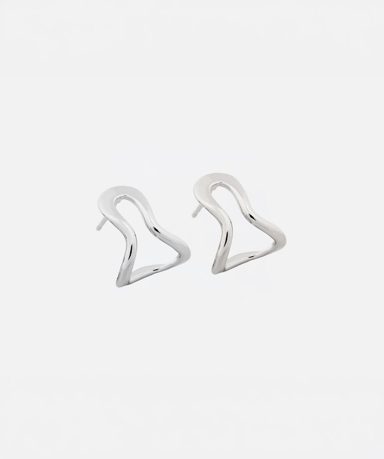 Conchi silver huggie earrings by PIERETTI, handcrafted small silver hoop earrings with modern design