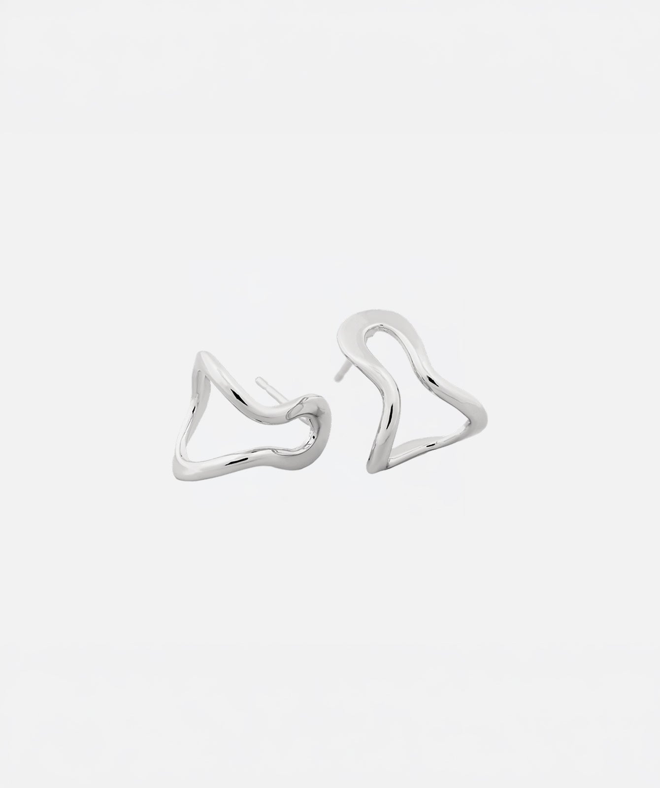 Conchi silver huggie earrings by PIERETTI, polished silver hoop design detail