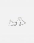 Conchi silver huggie earrings by PIERETTI, polished silver hoop design detail