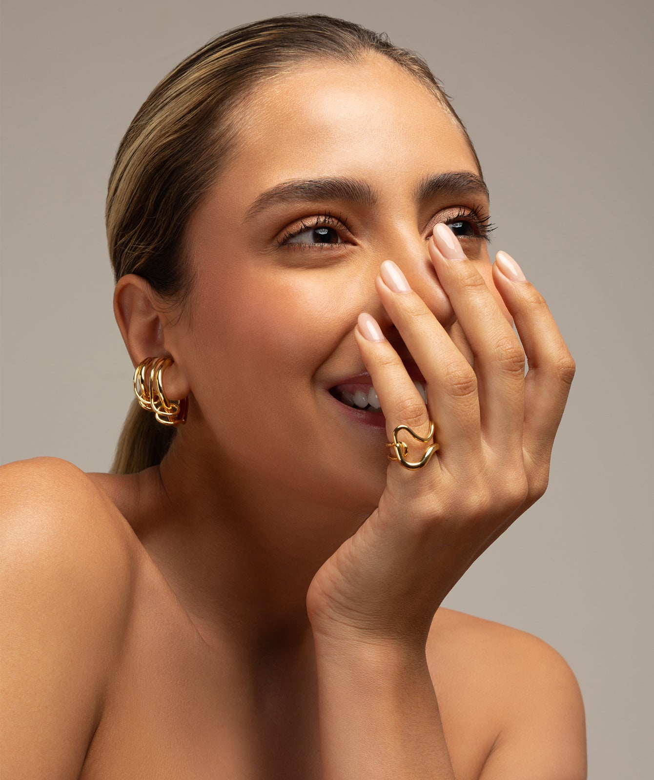 Cristine gold ring by PIERETTI worn on hand, lightweight gold-plated ring for stacking or everyday styling