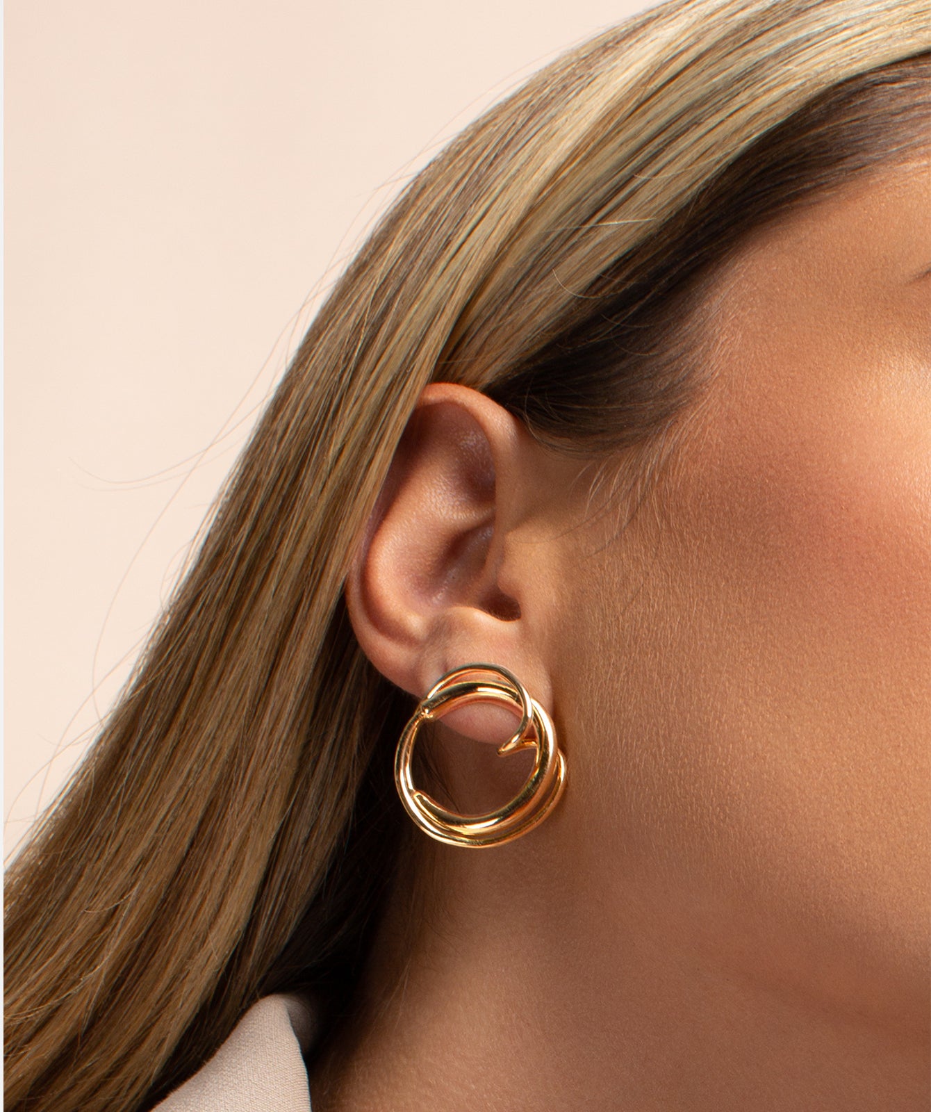 Cher gold earrings by PIERETTI styled with modern outfit, elegant gold earrings for day to night