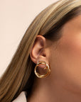 Cher gold earrings by PIERETTI styled with modern outfit, elegant gold earrings for day to night