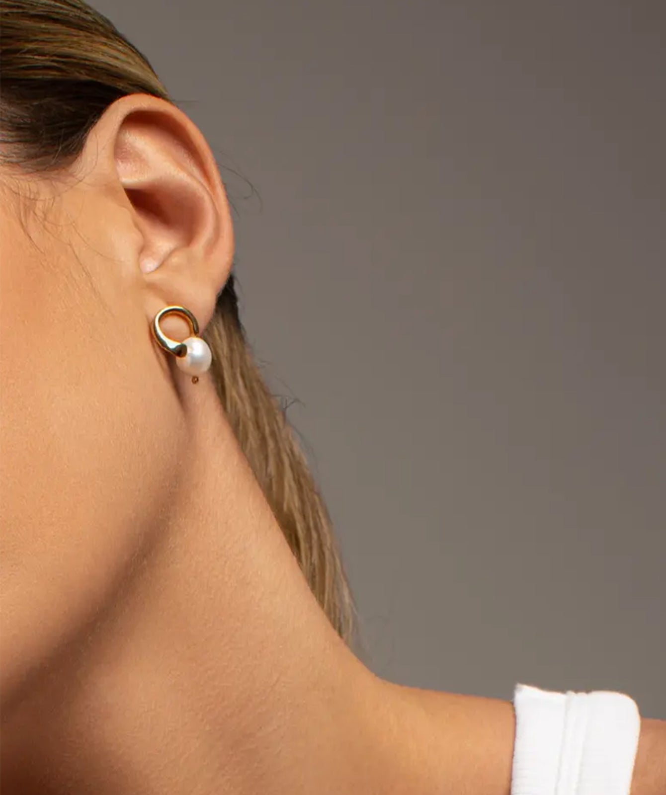 Clara freshwater pearl earrings by PIERETTI, natural pearl detail with polished finish