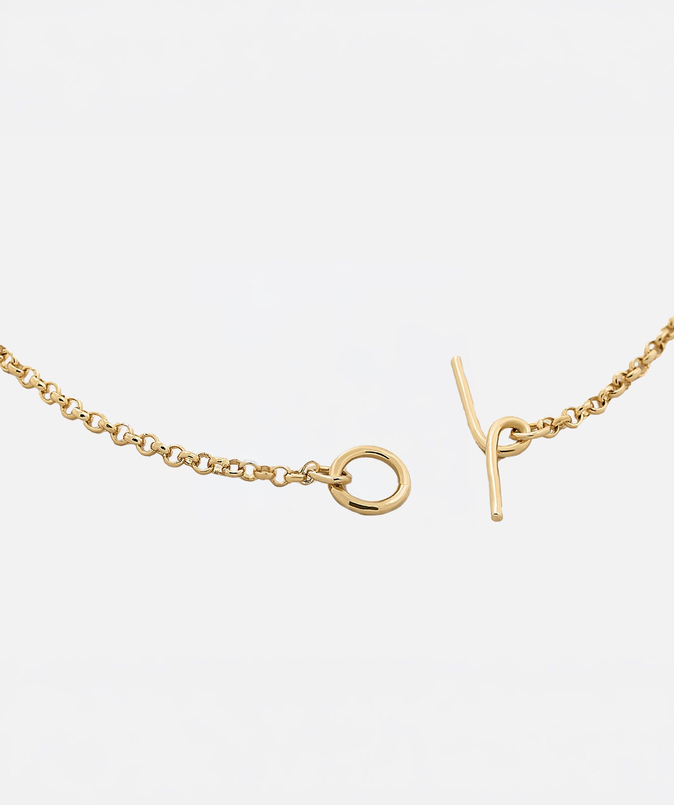 Celine pendant necklace by PIERETTI, polished gold-plated chain and pendant detail