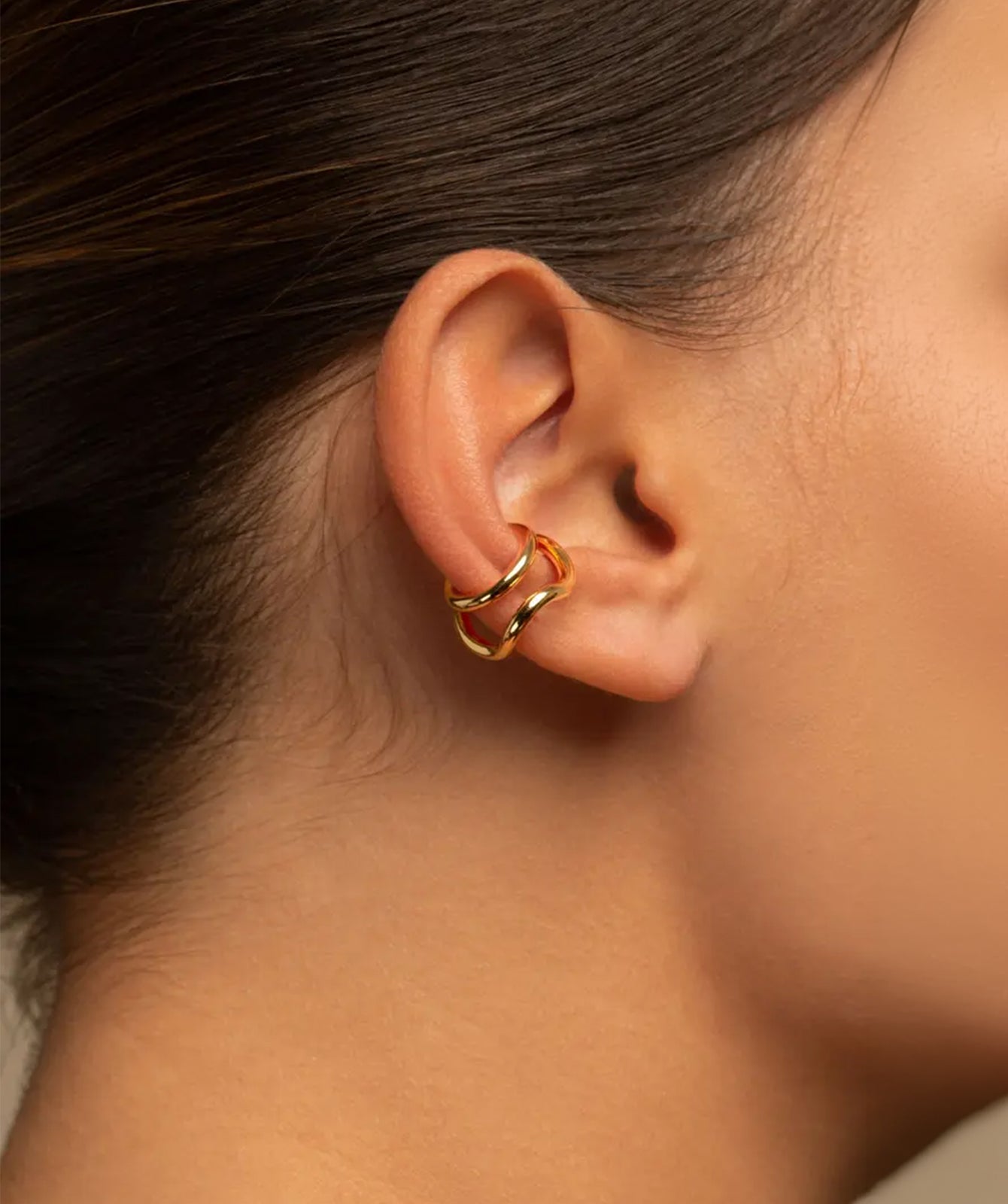Naeva double ear cuff by PIERETTI, polished 18K gold-plated sculptural design detail
