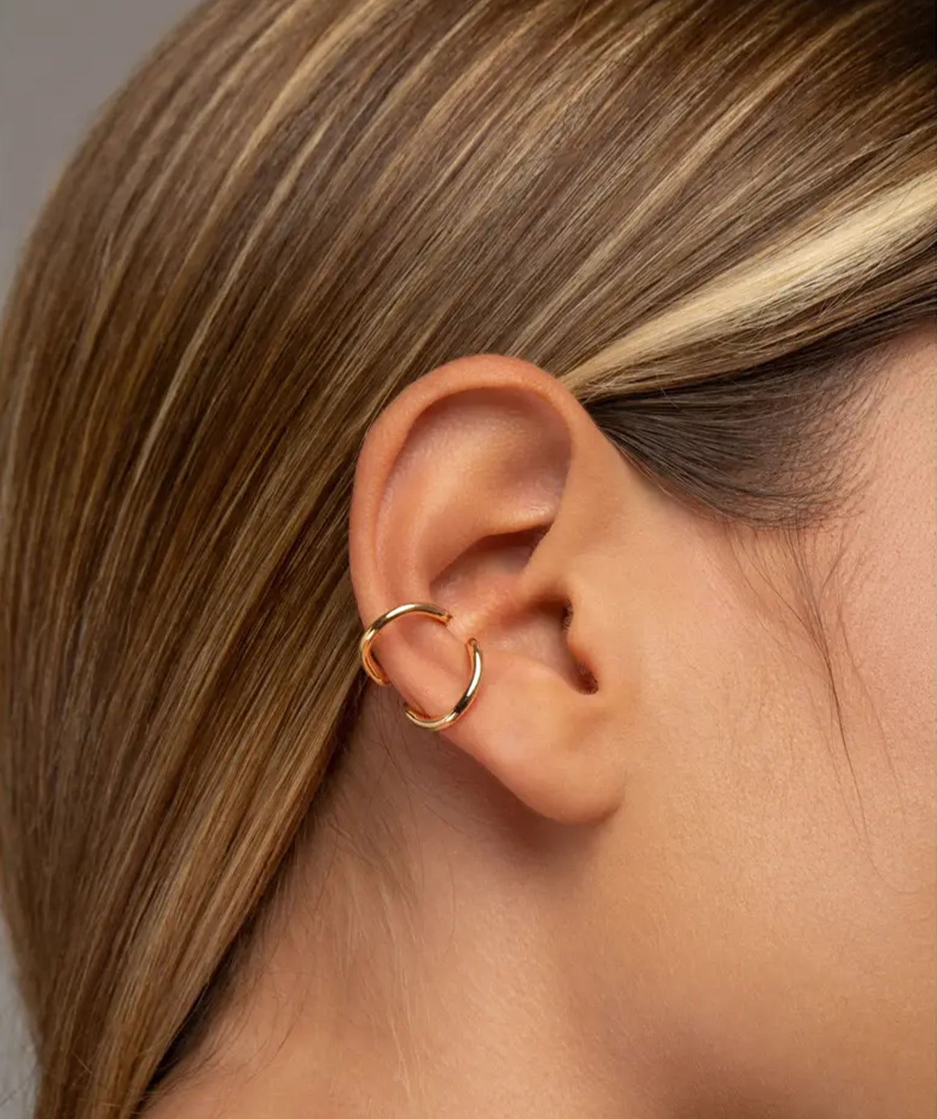 Nora gold ear cuff by PIERETTI, polished gold-plated design detail 