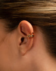 Clau twisted gold ear cuff by PIERETTI, polished sculptural design detail