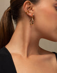 Naeva gold ear cuff by PIERETTI worn on ear, double band ear cuff no piercing
