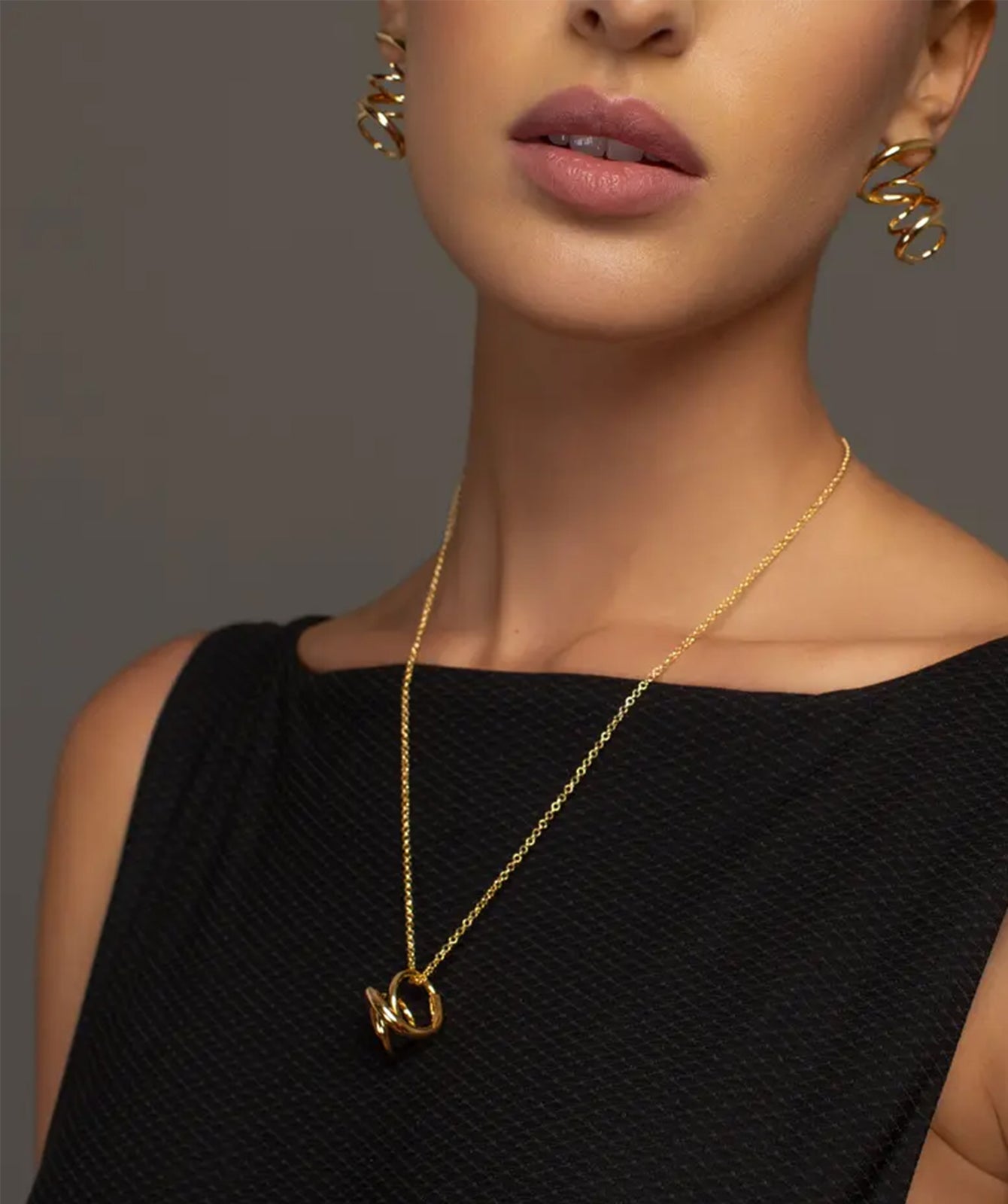 Celine gold pendant necklace by PIERETTI worn on neck, lightweight chain necklace