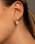 Clara pearl stud earrings by PIERETTI styled with modern look, elegant minimalist pearl studs