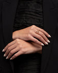 Double wave gold ring by PIERETTI, polished sculptural design detail