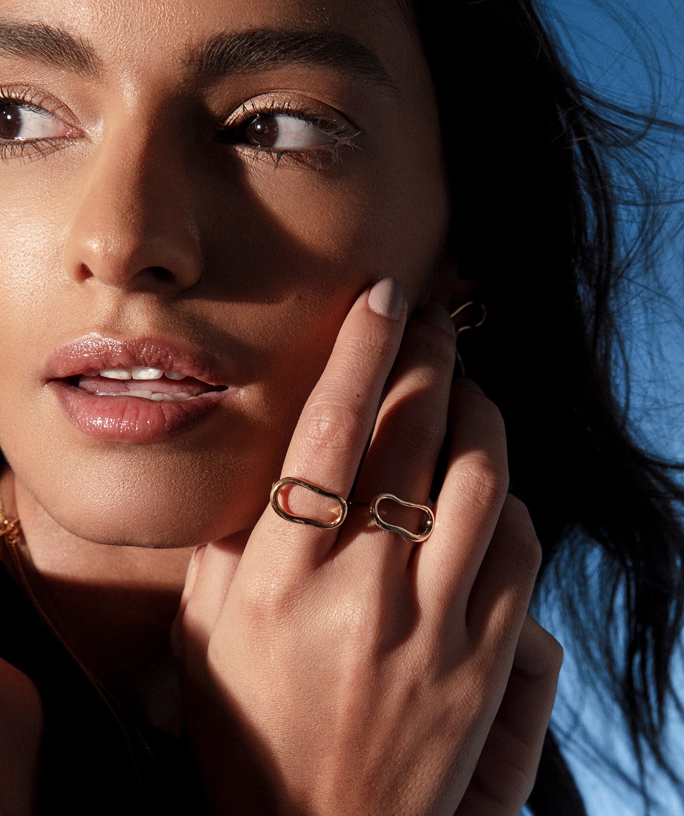 Ninon gold ring by PIERETTI worn on hand, lightweight stackable gold ring