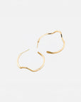 Noele large gold wave hoop earrings by PIERETTI in 18K gold plating, handcrafted statement hoops