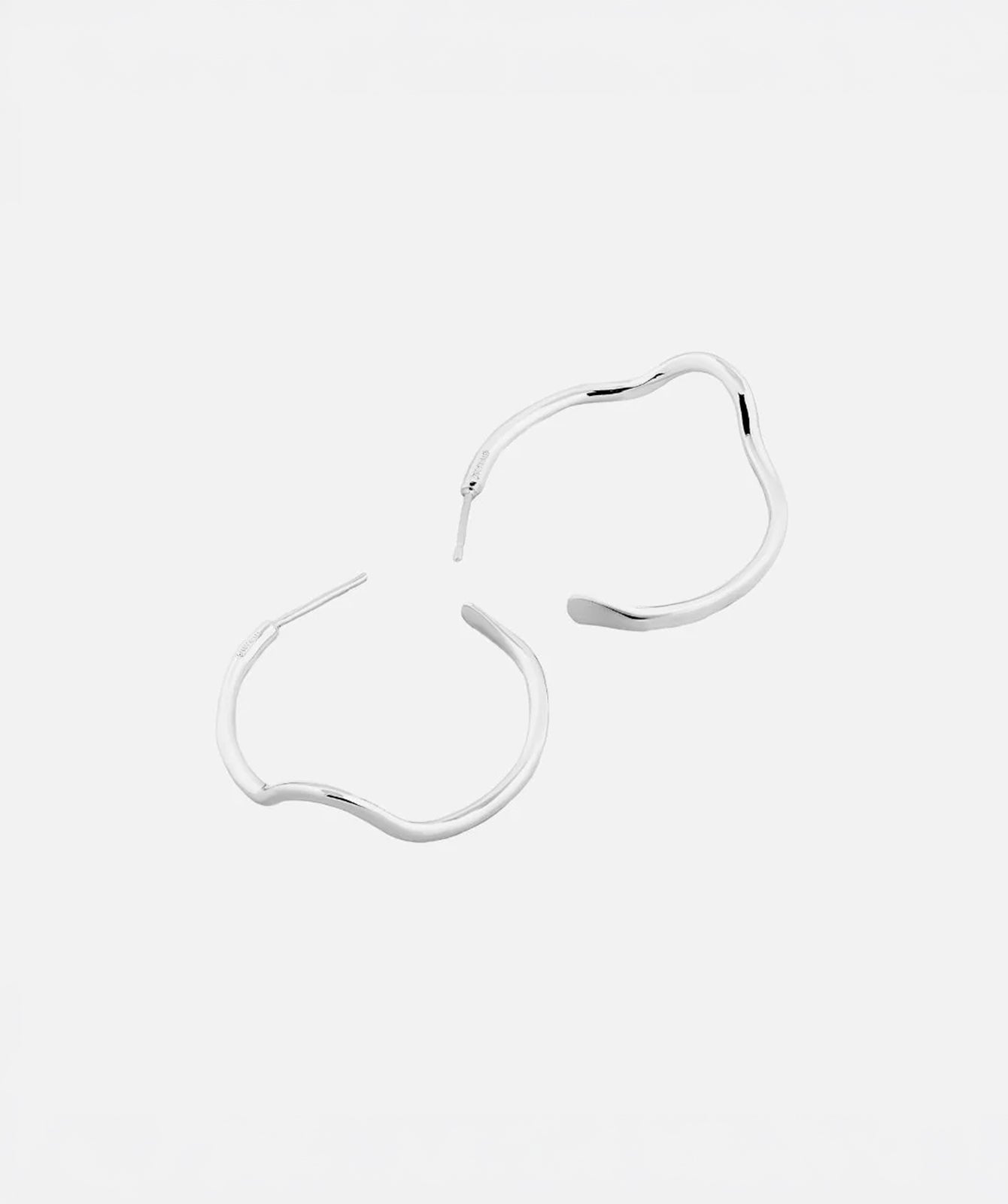 Noele large silver wave hoop earrings by PIERETTI in 925 silver, handcrafted statement hoops