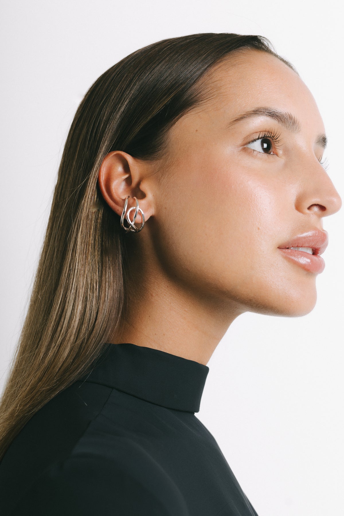Model wearing Fefe Large Stackable Ear Cuff in Silver Plate by Pieretti