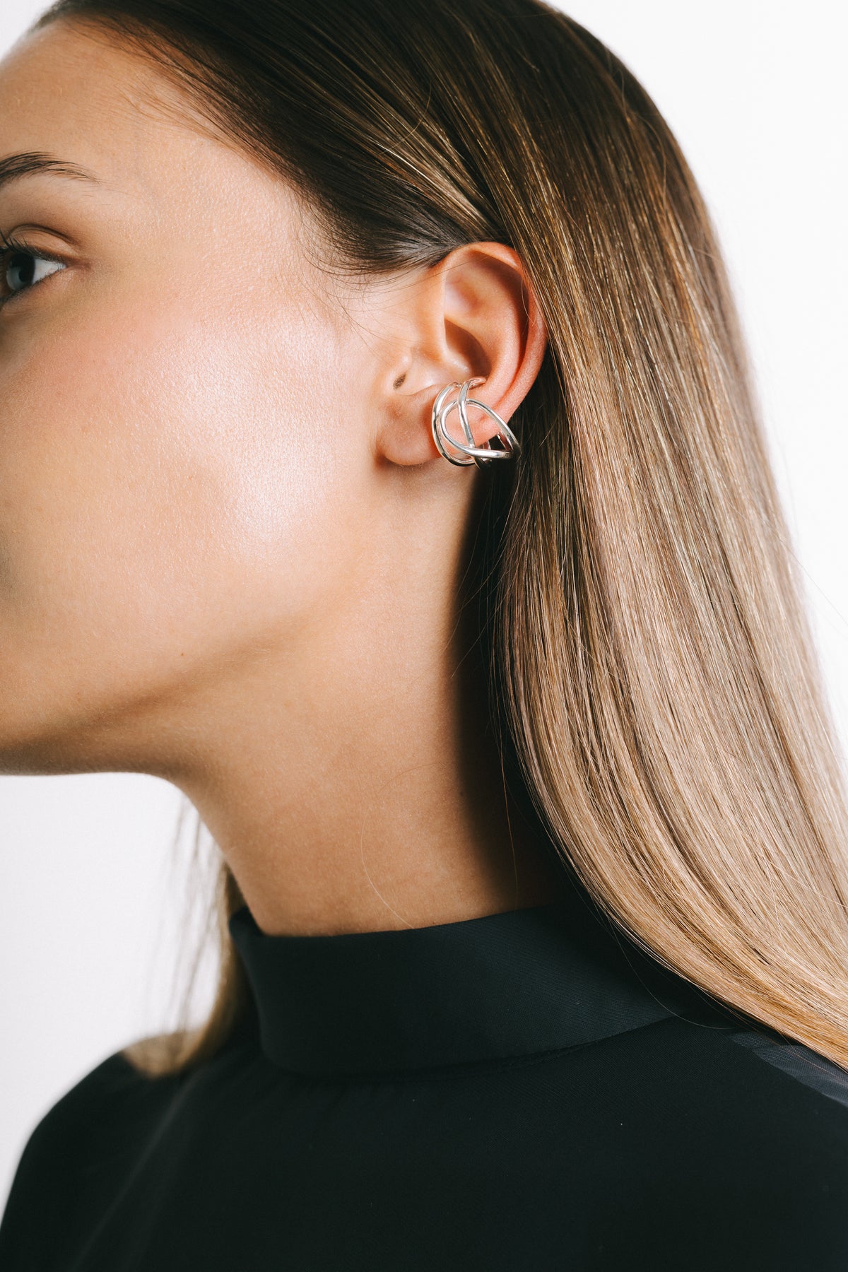 Model wearing Fefe Medium Stackable Ear Cuff in Silver Plate by Pieretti