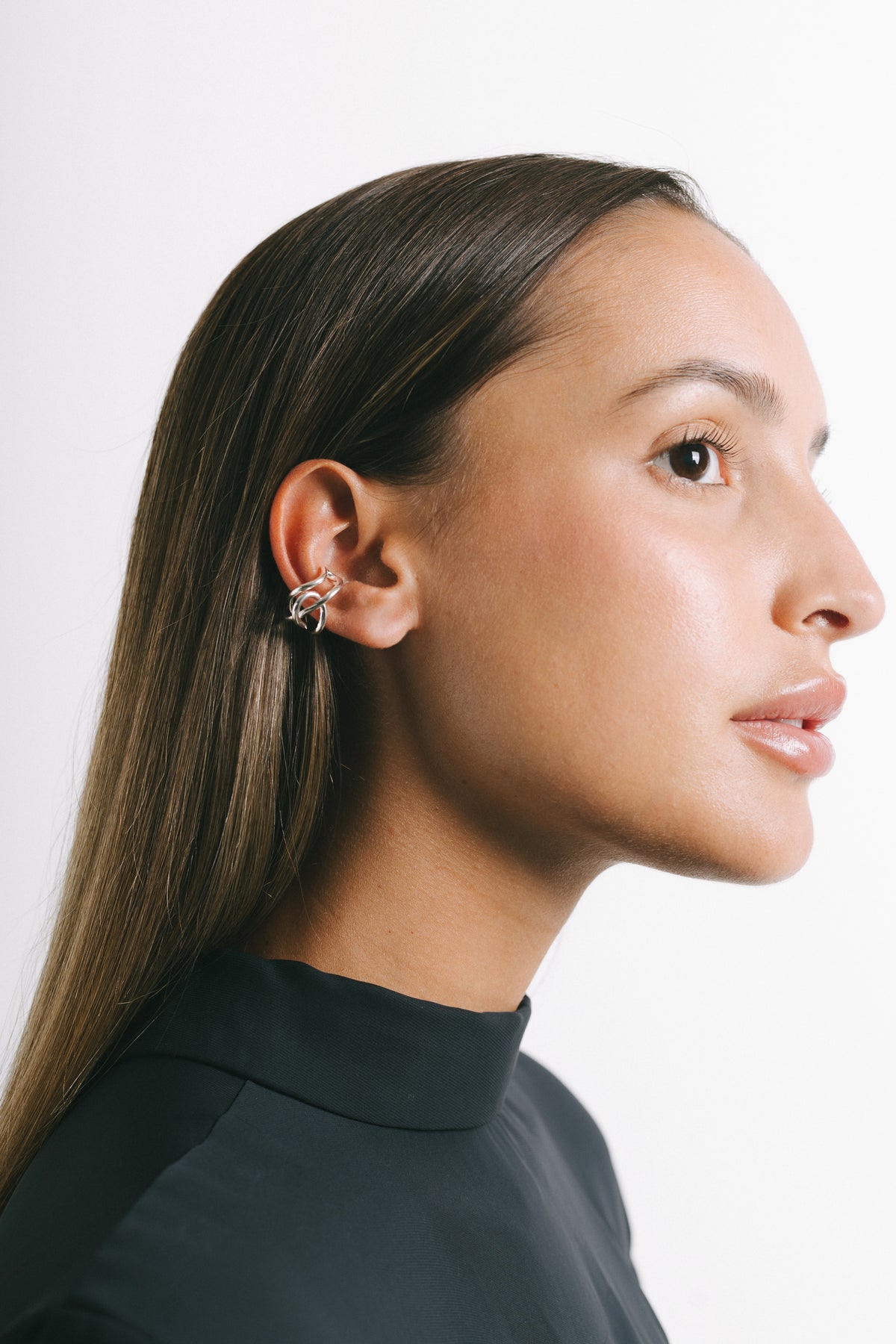 Model wearing Fefe Small Stackable Ear Cuff in Silver Plate by Pieretti