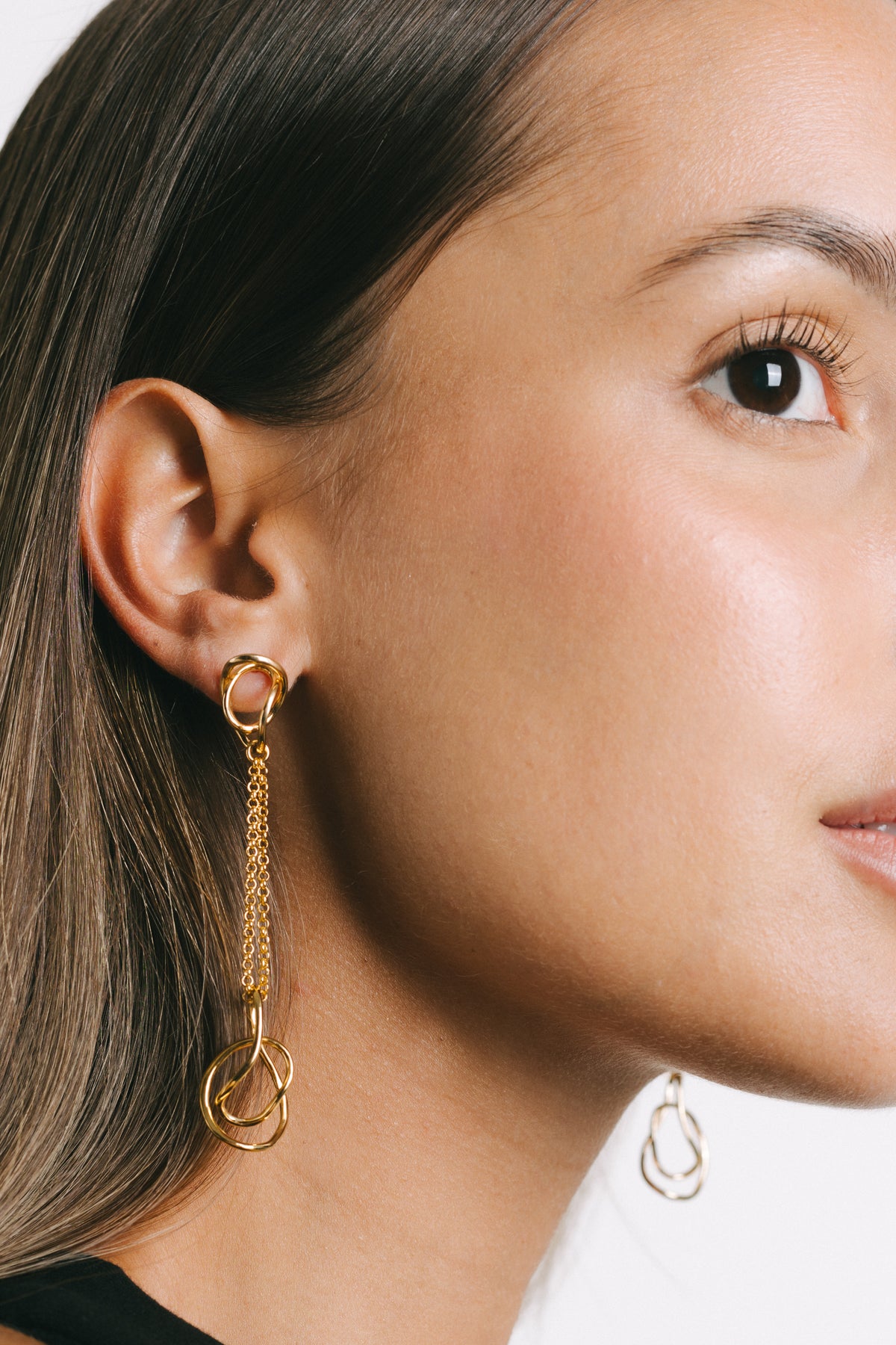 Model wearing Fiorella Chain Drop Earrings in Gold Plate by Pieretti