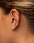 Nora silver ear cuff by PIERETTI worn on ear, minimalist ear cuff no piercing