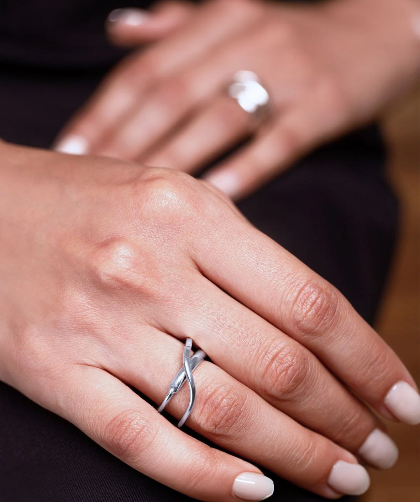 Cameron silver ring by PIERETTI worn on hand, lightweight stackable silver ring