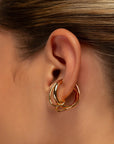 Colette twisted ear cuff by PIERETTI, polished gold-plated sculptural design detail