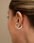 Colette silver ear cuff by PIERETTI worn on ear, twisted small ear cuff no piercing